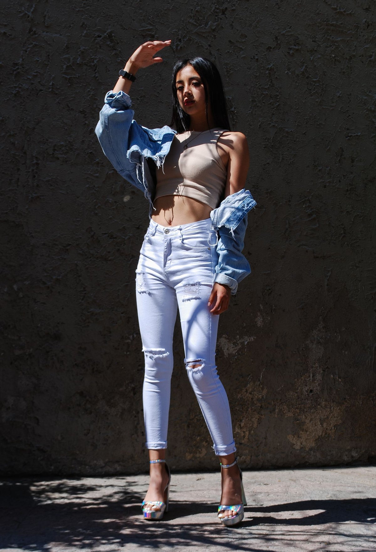 Woman wearing denim jeans outfit