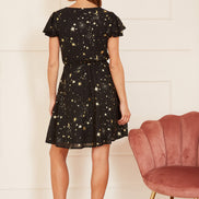 Mela Black Foil Star Print Wrap Skater Dress