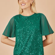 Yumi Green Sequin Top with Sheer Sleeves and Cut Out Back