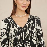 Yumi Black Abstract Print Ruched Midi Dress with Long Sleeves