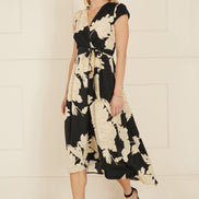 Yumi Black Blossom Print Wrap Midi with Dipped Hem